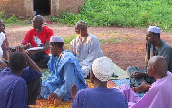 Several persons in discussion