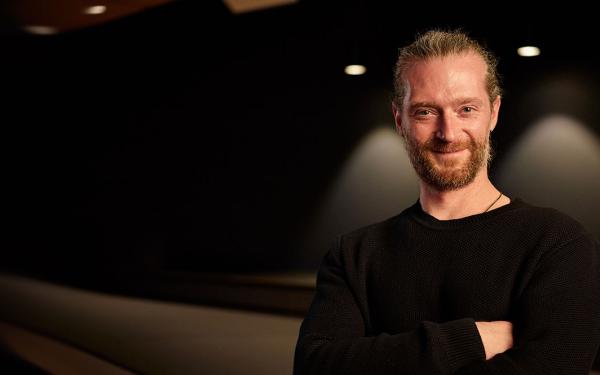 Portrait of a man in front of a dark background