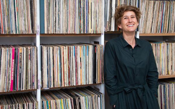 Woman in front of a shelf with records