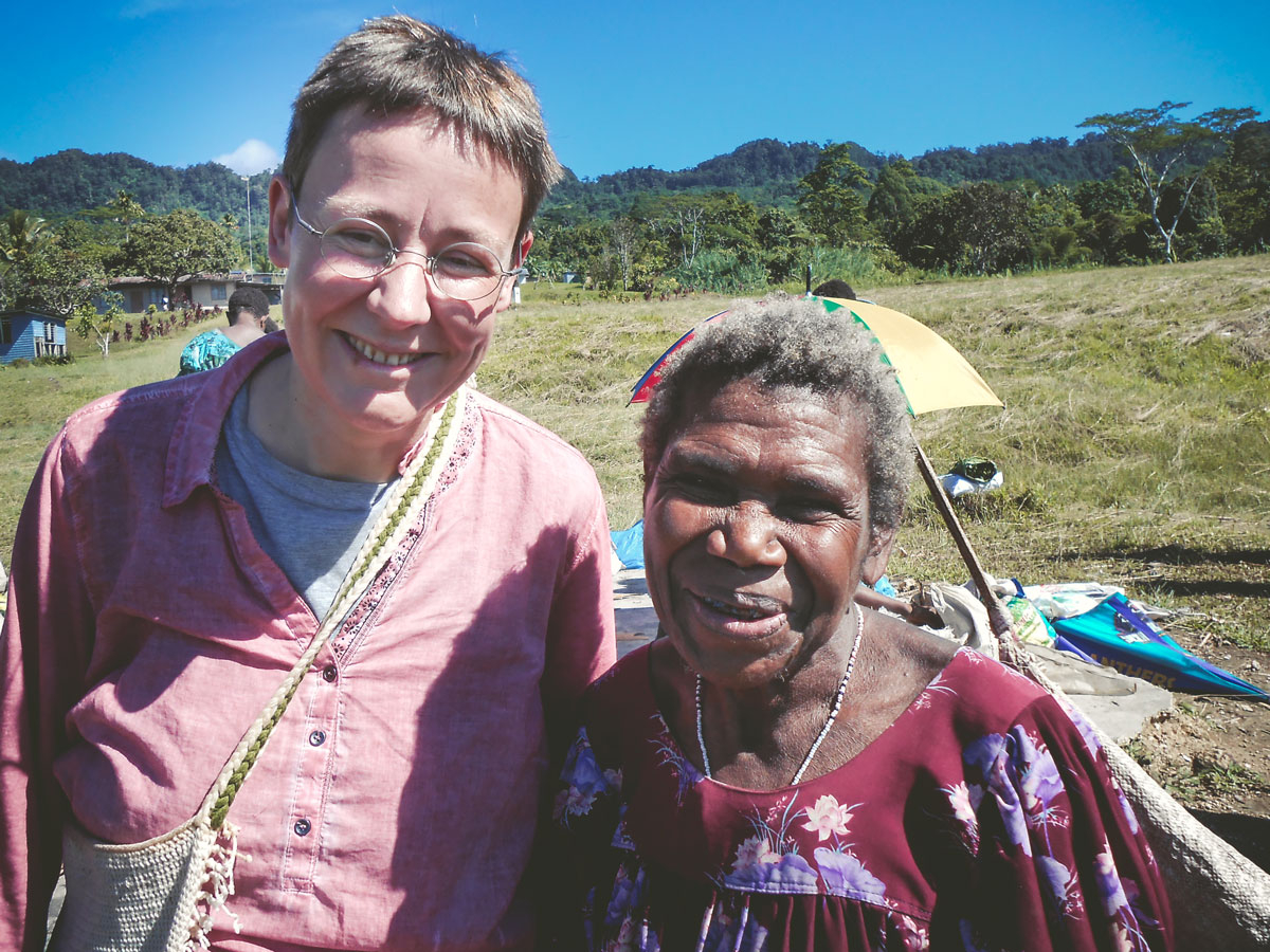 Birgit Hellwig with a villagers