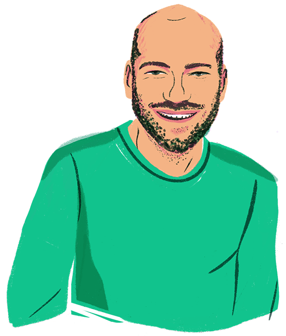Ein Mann mit einem grünen Pulli.